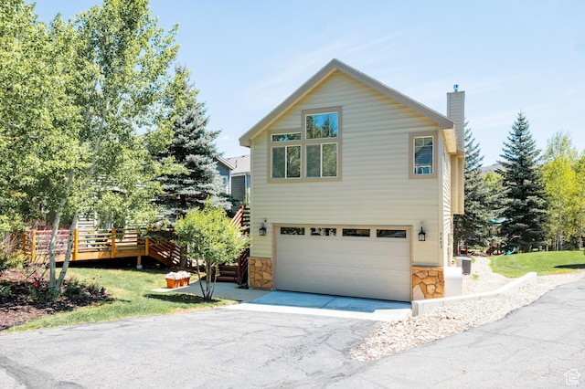 7403 Brook Hollow Loop Rd, Park City, UT 84098 - view of side of property with a chimney, a garage, asphalt driveway, stone siding, and stairway