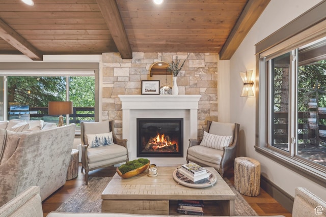 3058 Elk Run Dr W, Park City, UT 84098 - living room featuring a wooden ceiling with exposed beams, a glass covered fireplace, plenty of natural light, wood finished floors, and radiator heating unit
