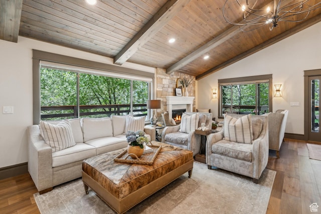 3058 Elk Run Dr W, Park City, UT 84098 - living room featuring hardwood / wood-style flooring, wooden ceiling, a chandelier, plenty of natural light, and a glass covered fireplace