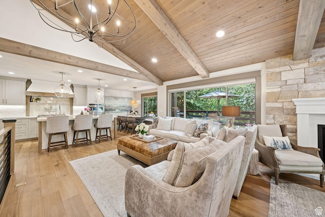 3058 Elk Run Dr W, Park City, UT 84098 - living area with light wood-style flooring, a chandelier, recessed lighting, high vaulted ceiling, and a fireplace