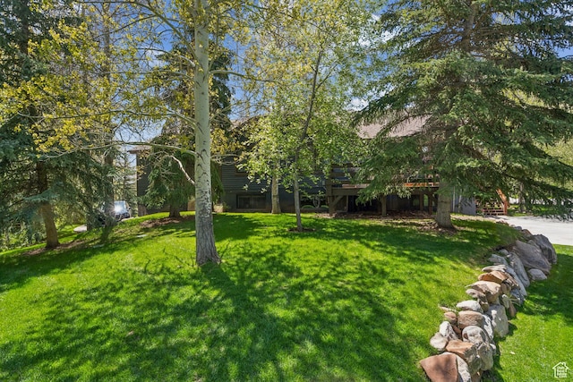 3058 Elk Run Dr W, Park City, UT 84098 - view of grassy yard with a deck