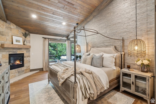 3058 Elk Run Dr W, Park City, UT 84098 - bedroom with a wood ceiling with exposed beams, a stone fireplace, recessed lighting, high vaulted ceiling, and wood finished floors