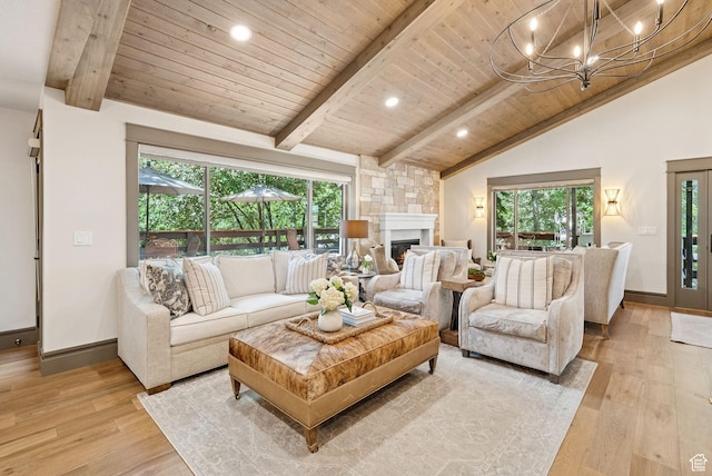 3058 Elk Run Dr W, Park City, UT 84098 - living area with healthy amount of natural light, light wood finished floors, wooden ceiling, a fireplace, and a chandelier