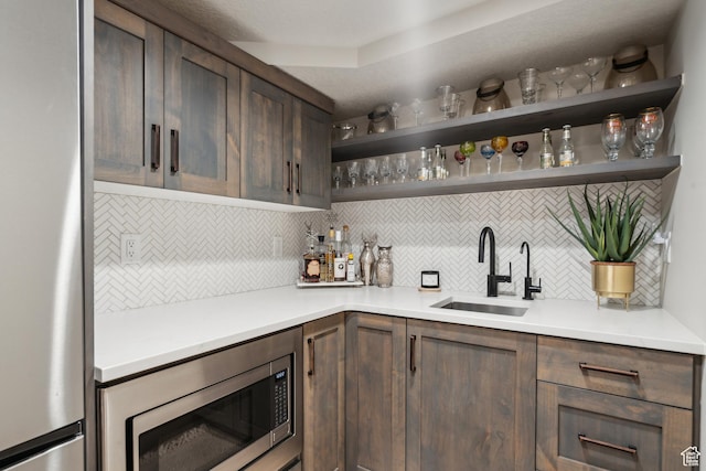 3058 Elk Run Dr W, Park City, UT 84098 - indoor wet bar with appliances with stainless steel finishes and decorative backsplash