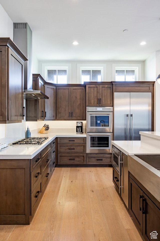201 N Kings Peak Ct Unit Cp-23, Heber City, UT 84032 - kitchen featuring built in appliances, light wood-style floors, dark brown cabinetry, light countertops, and recessed lighting