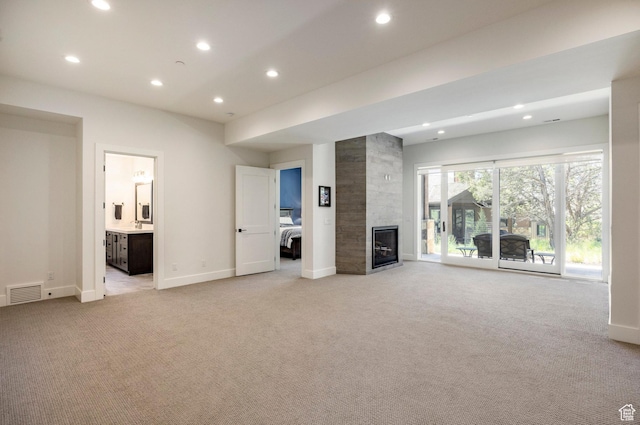 201 N Kings Peak Ct Unit Cp-23, Heber City, UT 84032 - unfurnished living room with light carpet, recessed lighting, baseboards, and a fireplace