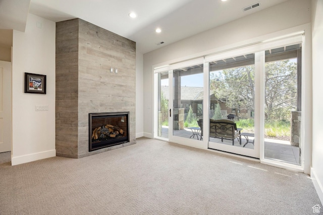 201 N Kings Peak Ct Unit Cp-23, Heber City, UT 84032 - unfurnished living room with a tiled fireplace, baseboards, carpet flooring, and recessed lighting