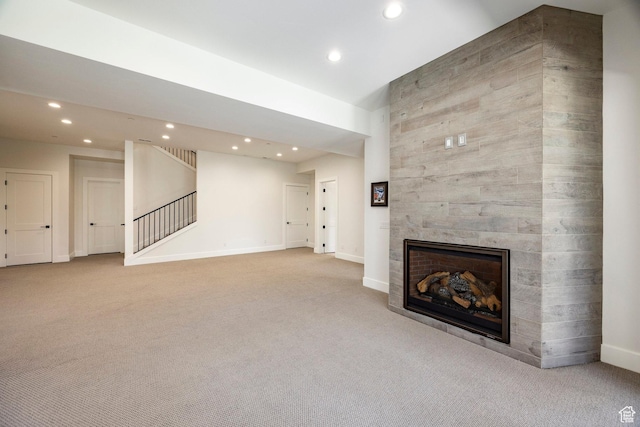 201 N Kings Peak Ct Unit Cp-23, Heber City, UT 84032 - unfurnished living room featuring carpet flooring, recessed lighting, a fireplace, baseboards, and stairway
