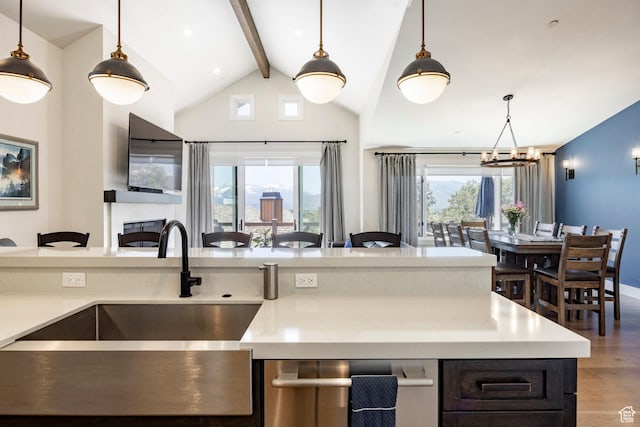 201 N Kings Peak Ct Unit Cp-23, Heber City, UT 84032 - kitchen featuring open floor plan, light wood finished floors, a sink, beamed ceiling, and a chandelier