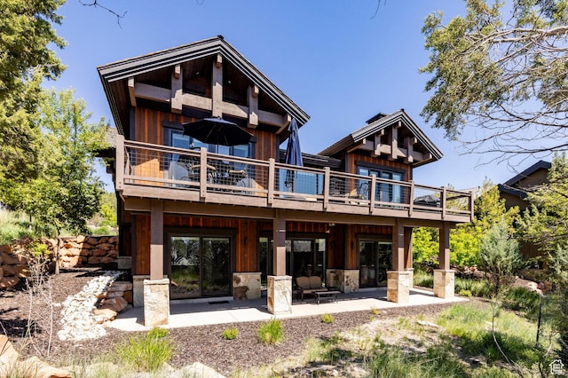 201 N Kings Peak Ct Unit Cp-23, Heber City, UT 84032 - rear view of house featuring a patio, a wooden deck, and board and batten siding