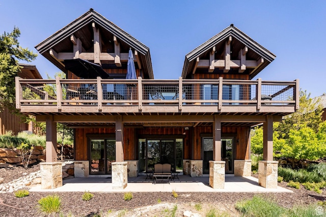 201 N Kings Peak Ct Unit Cp-23, Heber City, UT 84032 - rear view of house featuring a wooden deck, a patio, and board and batten siding