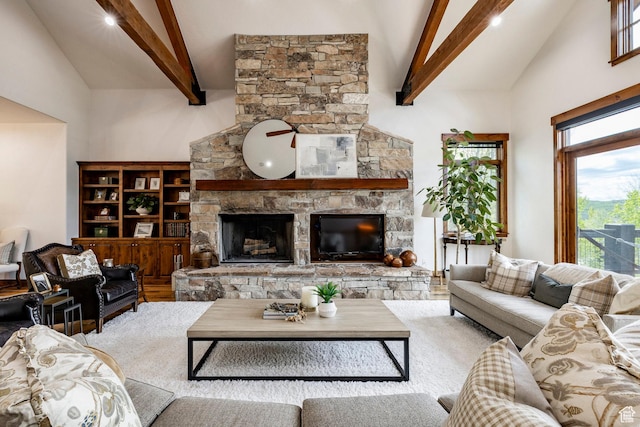 2938 Daybreaker Dr, Park City, UT 84098 - living area featuring high vaulted ceiling, beamed ceiling, a stone fireplace, and recessed lighting