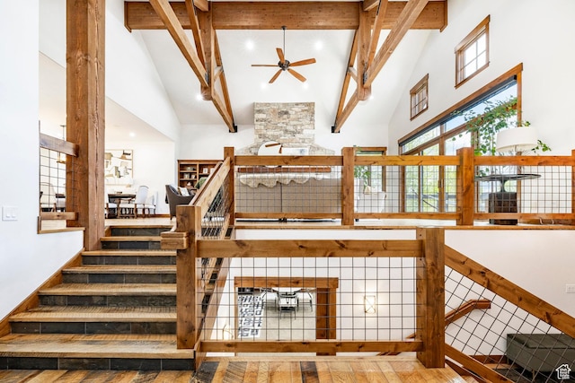 2938 Daybreaker Dr, Park City, UT 84098 - stairs featuring high vaulted ceiling, a ceiling fan, beam ceiling, and wood finished floors