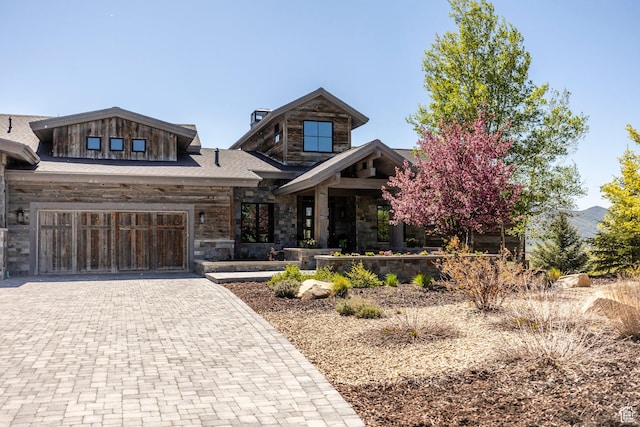 5925 Mountain Ranch Dr, Park City, UT 84098 - view of front of property with stone siding, decorative driveway, and a garage