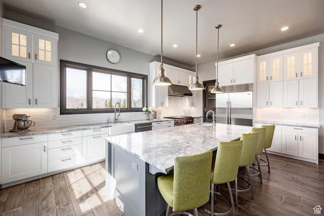5925 Mountain Ranch Dr, Park City, UT 84098 - kitchen with premium appliances, under cabinet range hood, a sink, backsplash, and recessed lighting