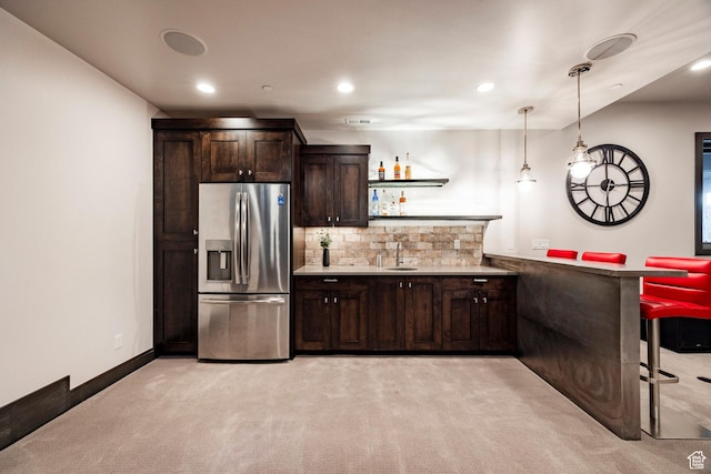 5925 Mountain Ranch Dr, Park City, UT 84098 - kitchen with stainless steel fridge, a sink, light colored carpet, dark brown cabinets, and light countertops