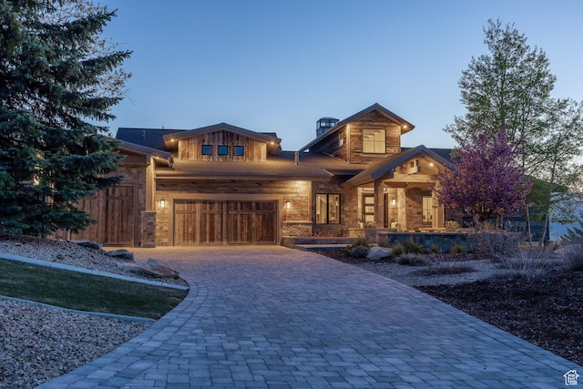 5925 Mountain Ranch Dr, Park City, UT 84098 - view of front of property with decorative driveway, stone siding, and a garage