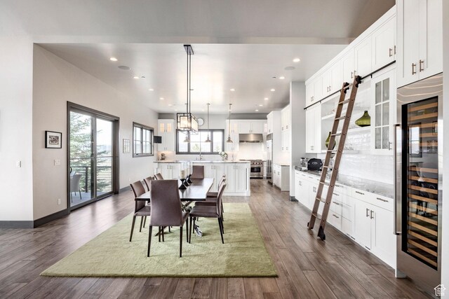 5925 Mountain Ranch Dr, Park City, UT 84098 - dining room featuring beverage cooler, dark wood finished floors, recessed lighting, and baseboards