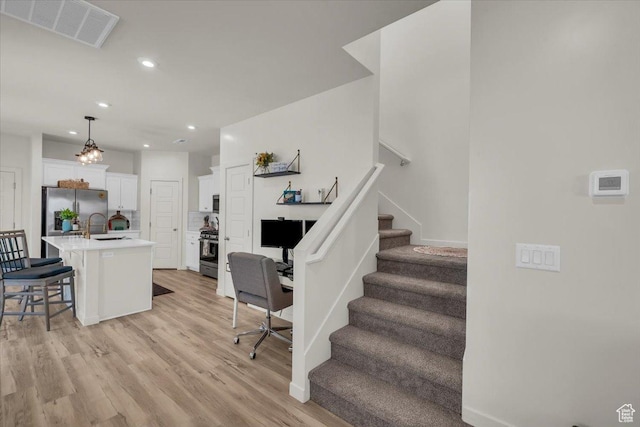 758 W Slate Ln, St George, UT 84790 - living area featuring stairs, light wood-style floors, recessed lighting, and baseboards