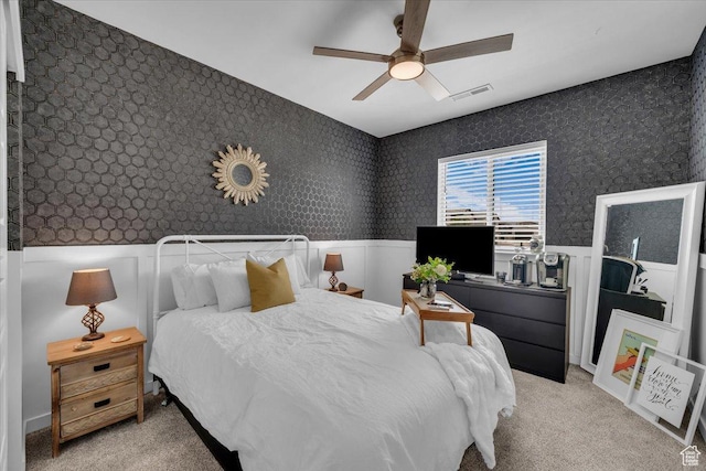 758 W Slate Ln, St George, UT 84790 - bedroom with wainscoting, wallpapered walls, light colored carpet, and ceiling fan