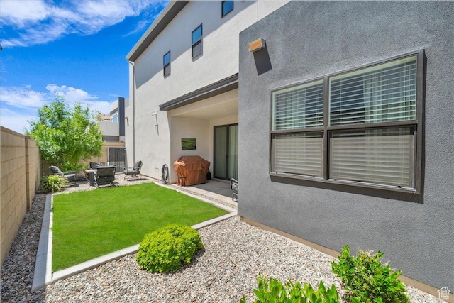 758 W Slate Ln, St George, UT 84790 - back of property featuring a patio area, stucco siding, and an outdoor fire pit