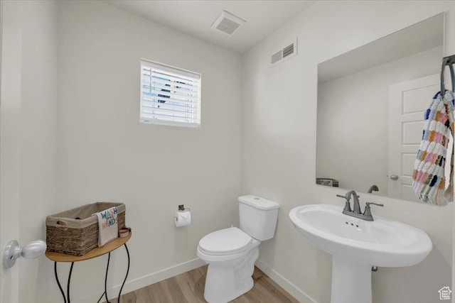 758 W Slate Ln, St George, UT 84790 - bathroom featuring wood finished floors, toilet, and baseboards