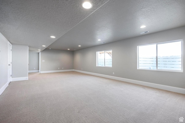 1460 Rocky Mountain Way Unit 223, Francis, UT 84036 - unfurnished room with a textured ceiling, baseboards, light carpet, and recessed lighting