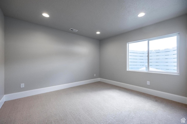 1460 Rocky Mountain Way Unit 223, Francis, UT 84036 - spare room with carpet flooring, recessed lighting, baseboards, and a textured ceiling