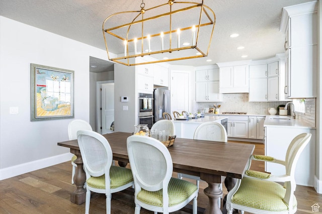 1460 Rocky Mountain Way Unit 223, Francis, UT 84036 - dining room featuring baseboards, recessed lighting, a textured ceiling, and dark wood finished floors