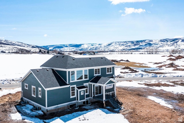 1460 Rocky Mountain Way Unit 223, Francis, UT 84036 - snow covered rear of property with a shingled roof and a mountain view
