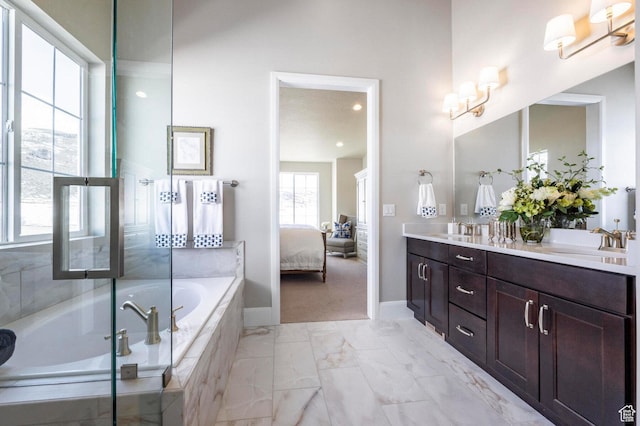 1460 Rocky Mountain Way Unit 223, Francis, UT 84036 - full bathroom with double vanity, a garden tub, ensuite bath, baseboards, and marble look tile flooring