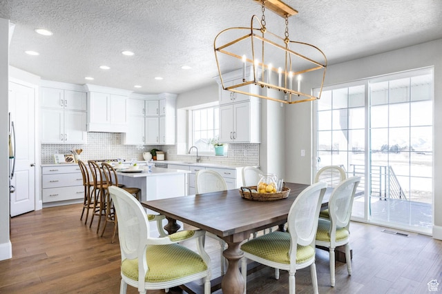 1460 Rocky Mountain Way Unit 223, Francis, UT 84036 - dining area featuring a textured ceiling, a chandelier, recessed lighting, and wood finished floors