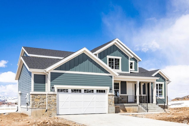 1460 Rocky Mountain Way Unit 223, Francis, UT 84036 - craftsman inspired home featuring a porch, stone siding, concrete driveway, and board and batten siding