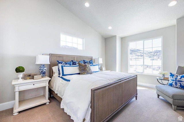1460 Rocky Mountain Way Unit 223, Francis, UT 84036 - carpeted bedroom with multiple windows, recessed lighting, baseboards, and lofted ceiling