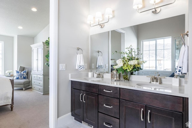 1460 Rocky Mountain Way Unit 223, Francis, UT 84036 - full bathroom featuring double vanity, ensuite bath, recessed lighting, and baseboards