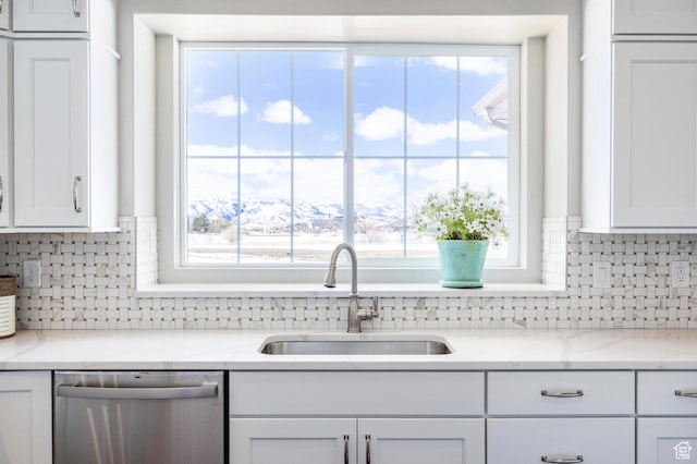 1460 Rocky Mountain Way Unit 223, Francis, UT 84036 - kitchen with dishwasher, a sink, white cabinets, tasteful backsplash, and healthy amount of natural light