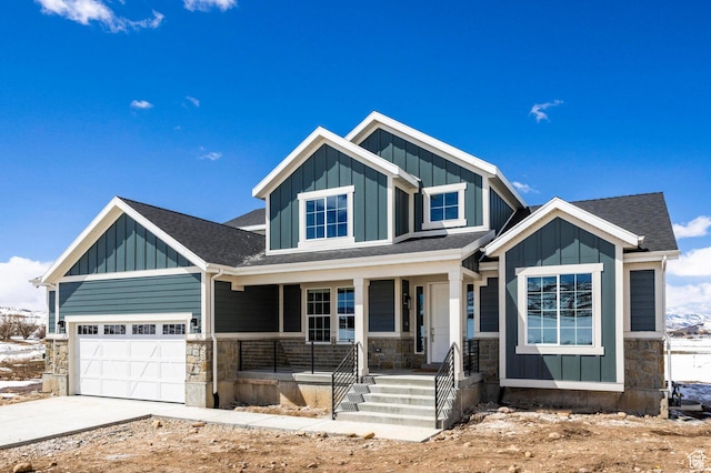 1460 Rocky Mountain Way Unit 223, Francis, UT 84036 - view of front facade featuring board and batten siding, stone siding, covered porch, and driveway