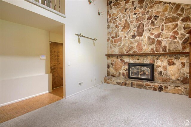 5725 S 1075 E, South Ogden, UT 84405 - unfurnished living room featuring a fireplace, baseboards, and carpet