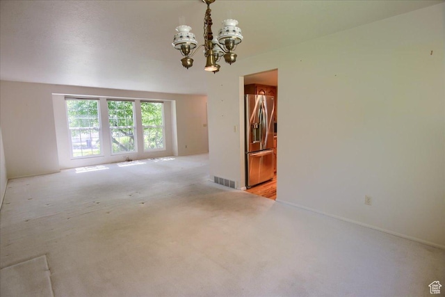 5725 S 1075 E, South Ogden, UT 84405 - spare room featuring a chandelier and light colored carpet