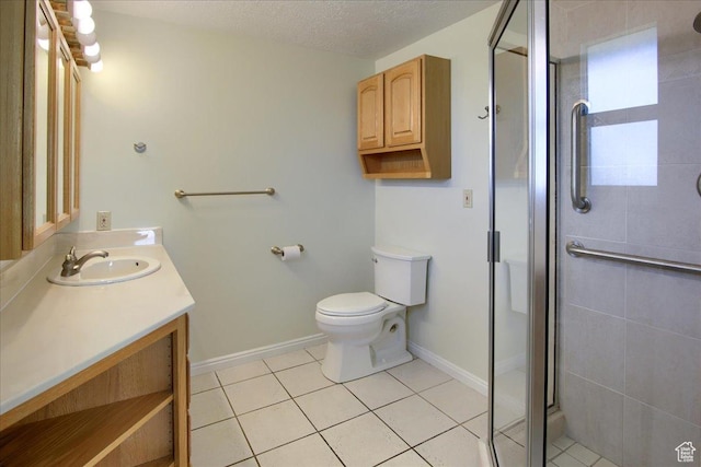 5725 S 1075 E, South Ogden, UT 84405 - bathroom with vanity, a stall shower, toilet, tile patterned floors, and baseboards
