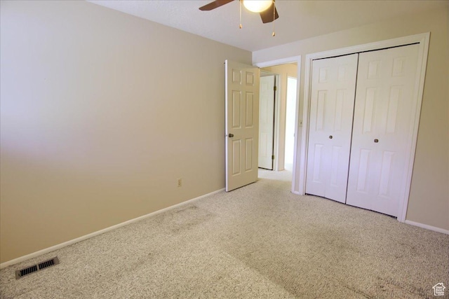5725 S 1075 E, South Ogden, UT 84405 - unfurnished bedroom with light colored carpet, baseboards, a closet, and a ceiling fan