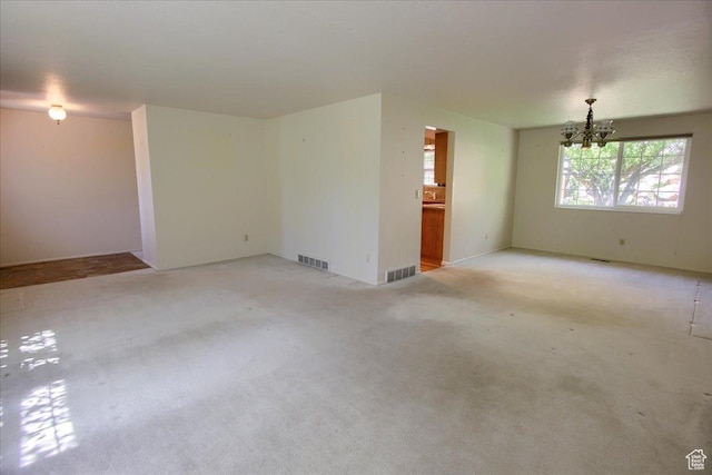 5725 S 1075 E, South Ogden, UT 84405 - unfurnished room with a chandelier and light carpet