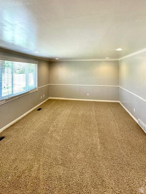 558 E Center St, Kaysville, UT 84037 - empty room featuring ornamental molding, dark colored carpet, and baseboards