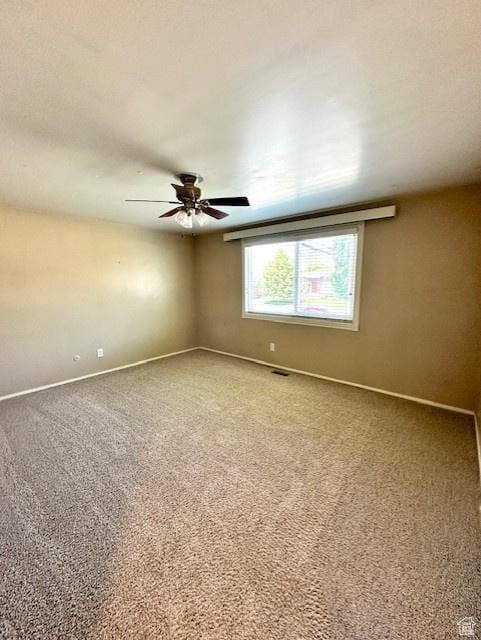 558 E Center St, Kaysville, UT 84037 - empty room featuring baseboards, carpet, and a ceiling fan