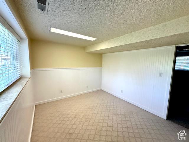558 E Center St, Kaysville, UT 84037 - spare room featuring a textured ceiling
