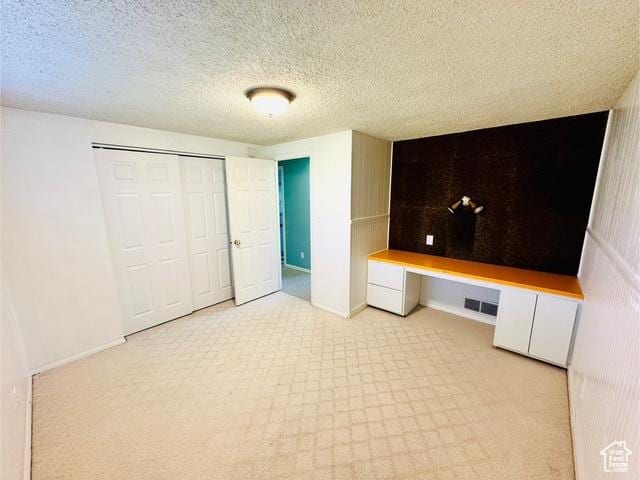 558 E Center St, Kaysville, UT 84037 - unfurnished bedroom featuring baseboards, a closet, and a textured ceiling
