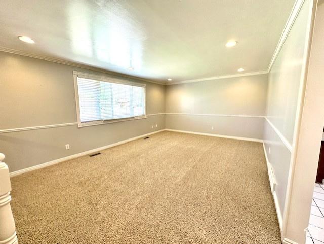 558 E Center St, Kaysville, UT 84037 - carpeted empty room with ornamental molding, recessed lighting, and baseboards