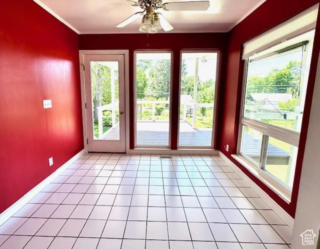 558 E Center St, Kaysville, UT 84037 - doorway to outside with a ceiling fan, crown molding, plenty of natural light, and baseboards