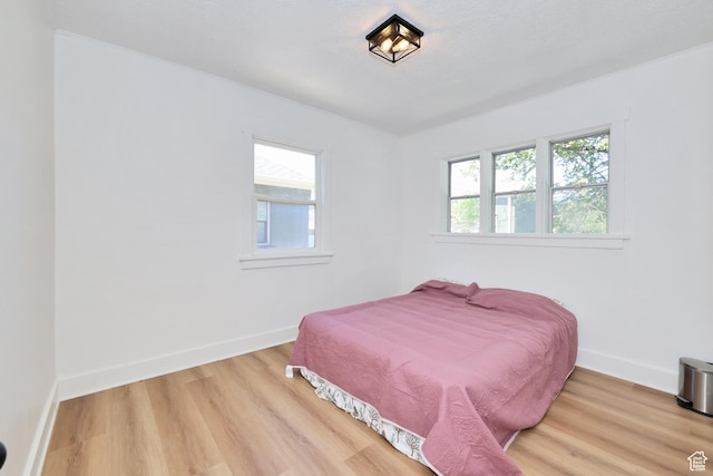 557 E Cleveland Ave, Salt Lake City, UT 84105 - bedroom featuring wood finished floors and baseboards