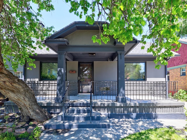 557 E Cleveland Ave, Salt Lake City, UT 84105 - view of front facade with a porch and stucco siding